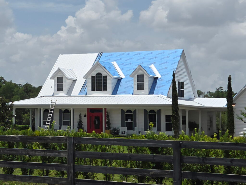 house with new roof being installed